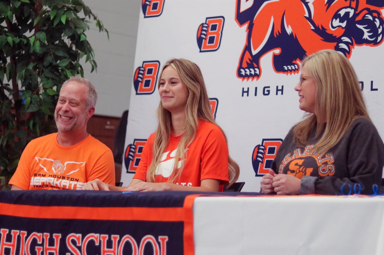 Bridgeland senior Madeleine Wilson, center, signed her letter of intent to run cross country and track at Sam Houston State.